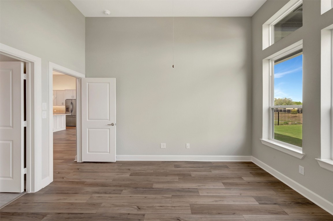 2423 Msn Hts Way Manvel, TX 77578 - Photo 38 of 49 a view of an empty room with wooden floor and window