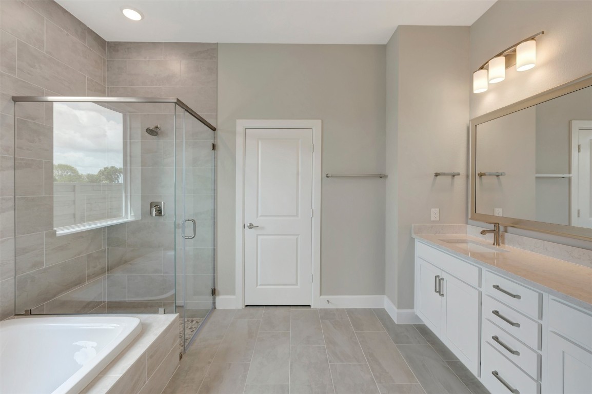 2423 Msn Hts Way Manvel, TX 77578 - Photo 40 of 49 a bathroom with a double vanity sink and a mirror