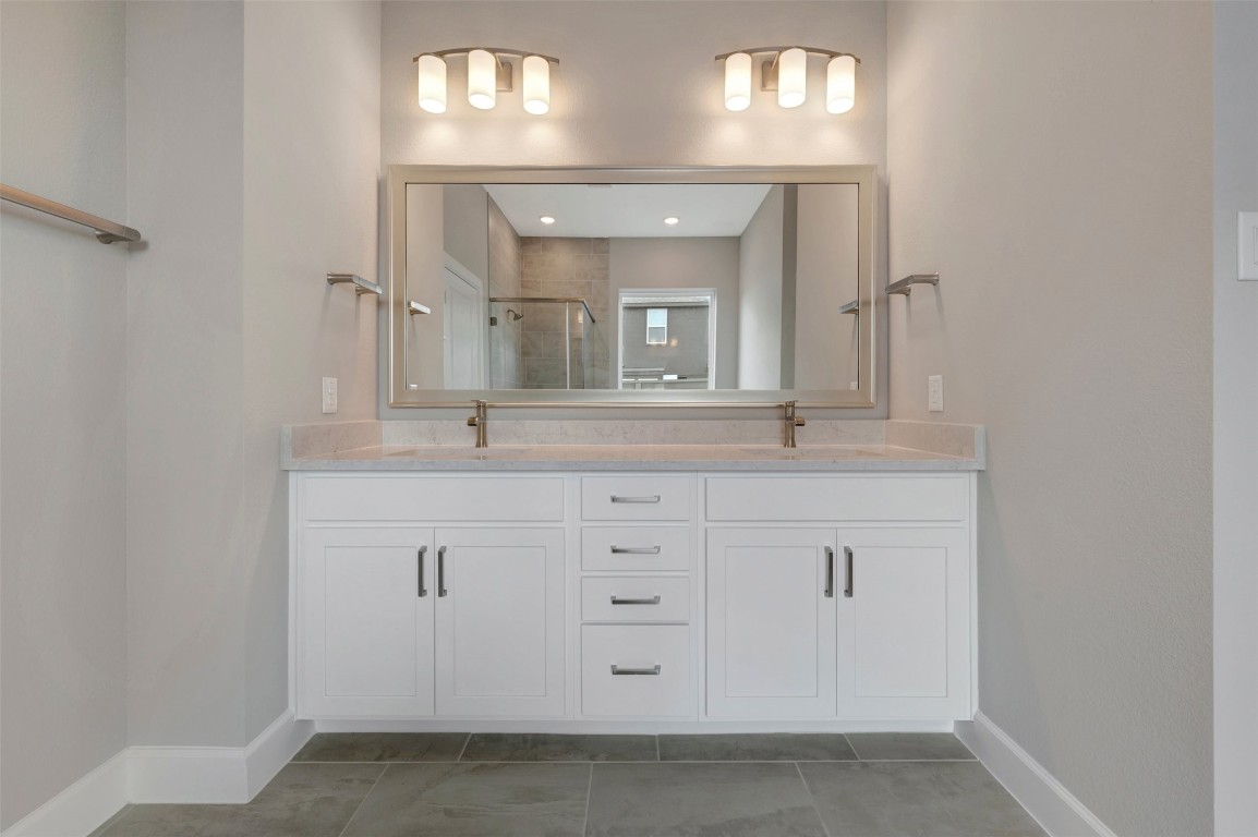 2423 Msn Hts Way Manvel, TX 77578 - Photo 43 of 49 a bathroom with a sink and a mirror
