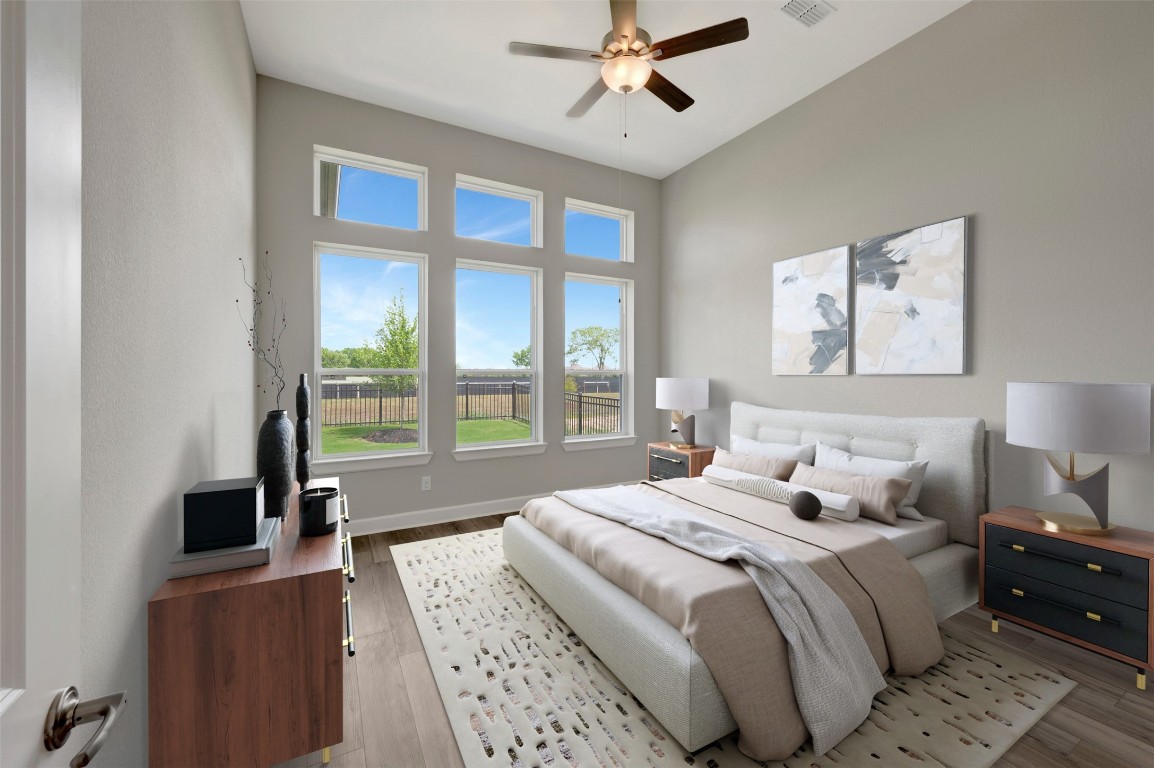 2423 Msn Hts Way Manvel, TX 77578 - Photo 8 of 49 a bedroom with a large bed and a window