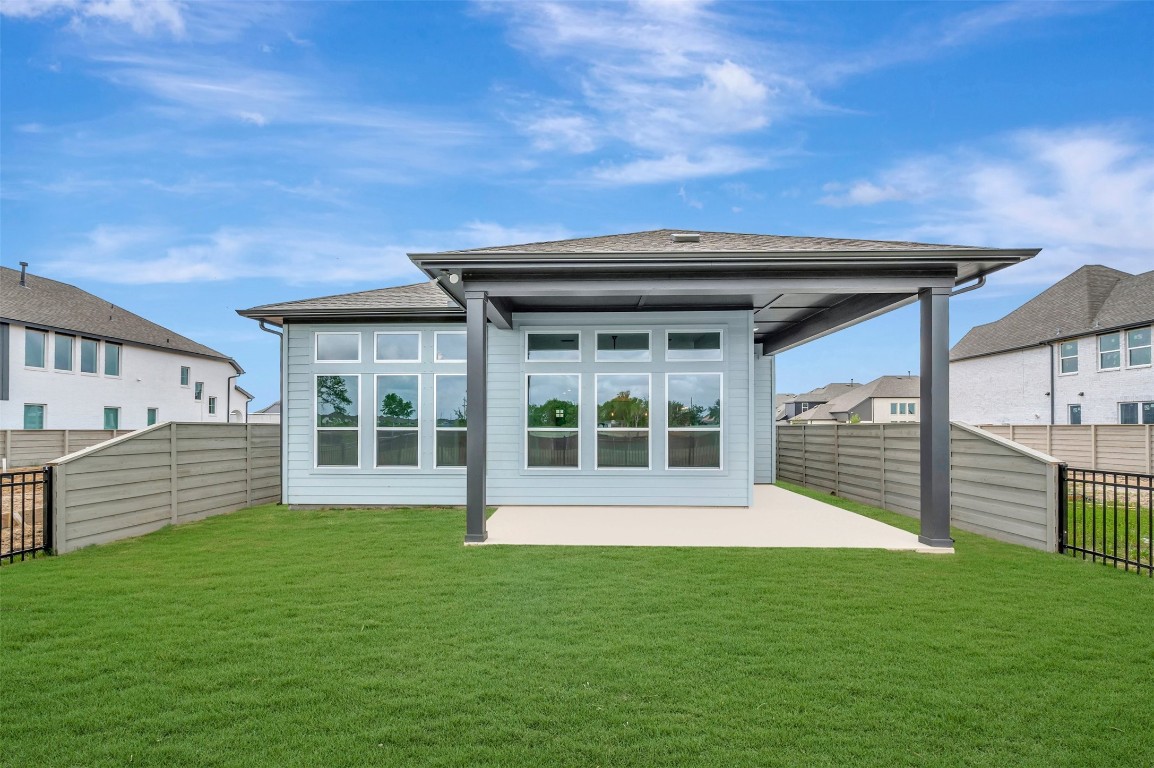 2423 Msn Hts Way Manvel, TX 77578 - Photo 10 of 49 a view of a backyard with a garden and plants