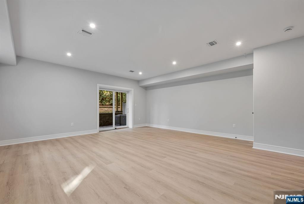 2449 Camner Street Fort Lee, NJ 07024 - Photo 41 of 49 a view of an empty room with wooden floor and a window
