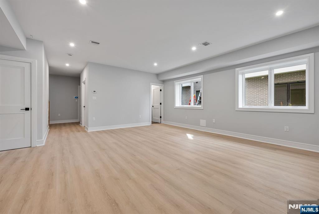 2449 Camner Street Fort Lee, NJ 07024 - Photo 42 of 49 a view of an empty room with wooden floor and a window