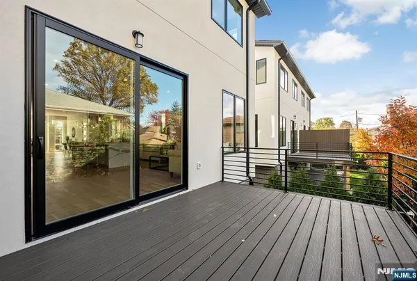 a view of a balcony with wooden floor
