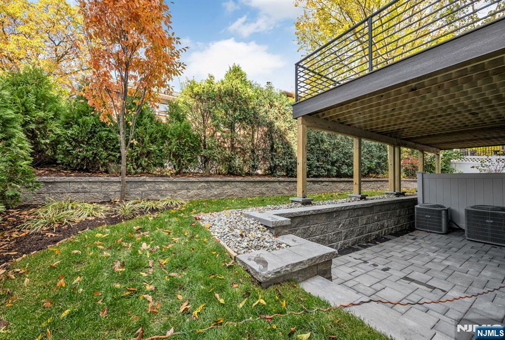 2449 Camner Street Fort Lee, NJ 07024 - Photo 47 of 49 a view of a backyard with a patio and a garden