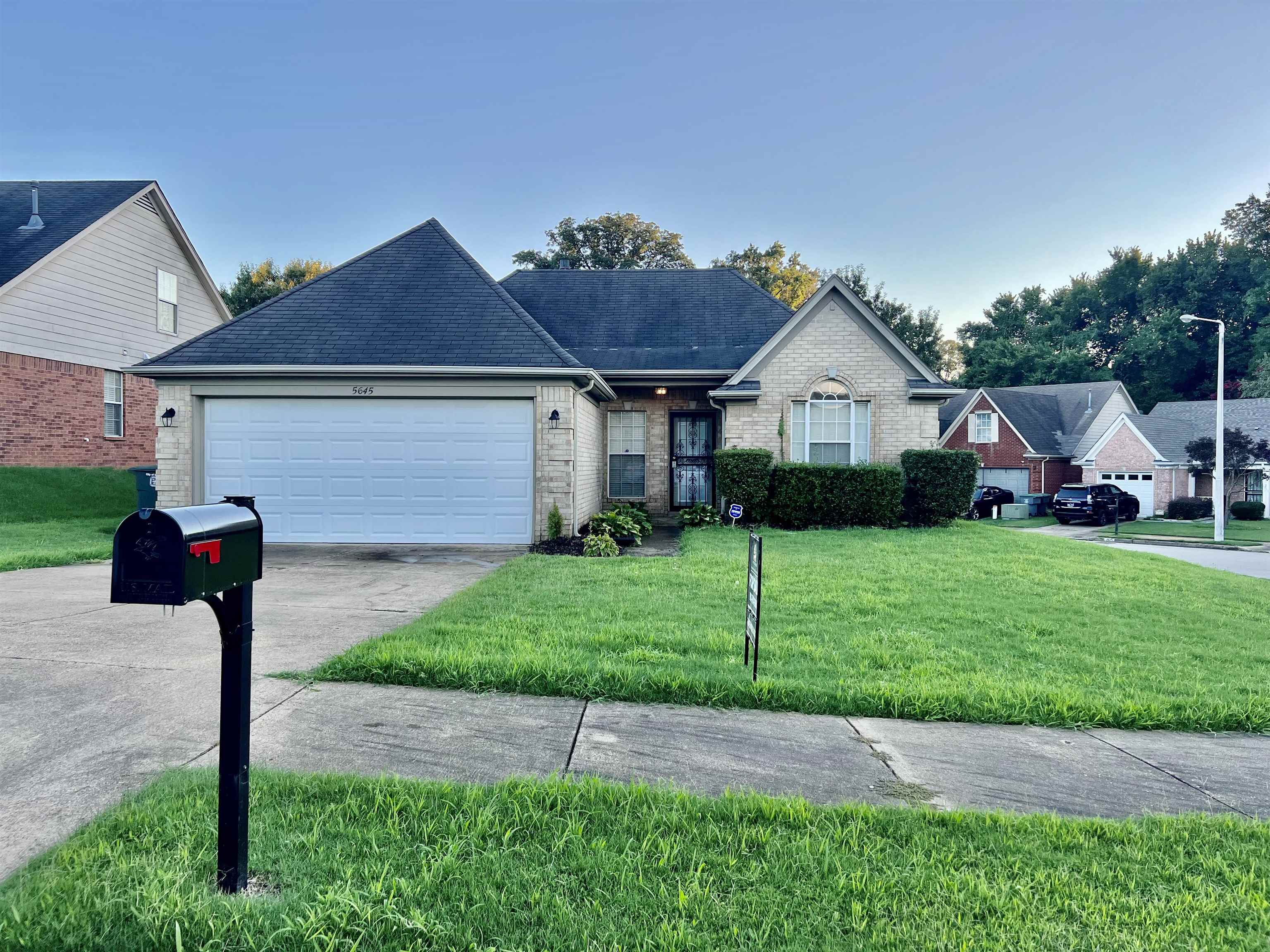 5645 Sycamore Ridge Road Memphis, TN 38134 - Photo 1 of 13 a front view of house with yard and green space