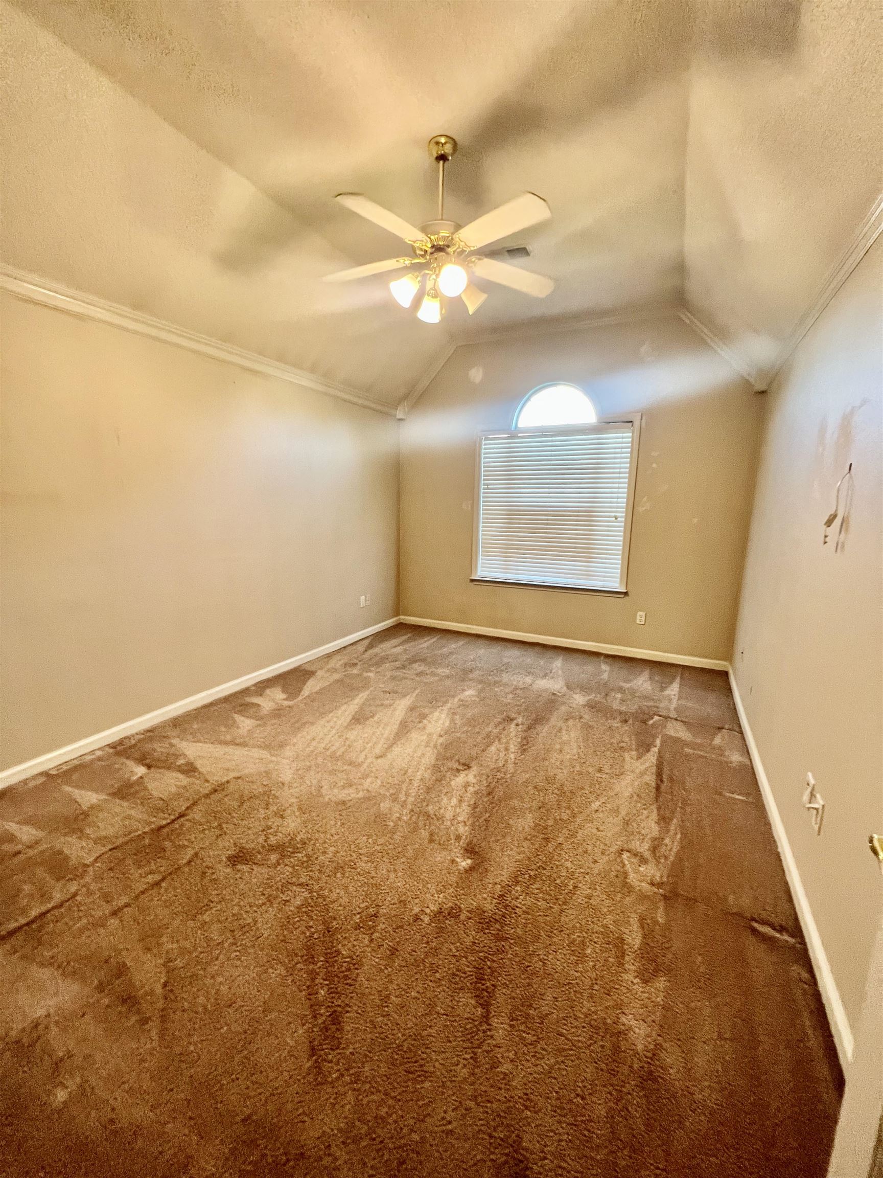 5645 Sycamore Ridge Road Memphis, TN 38134 - Photo 13 of 13 an empty room with a window and ceiling fan