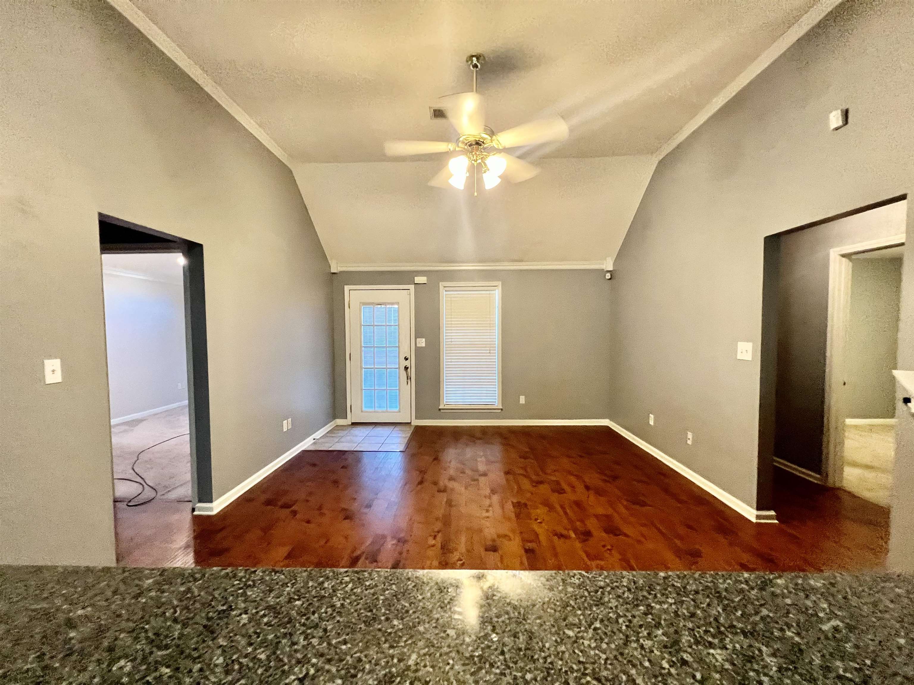 5645 Sycamore Ridge Road Memphis, TN 38134 - Photo 2 of 13 a view of an empty room with window and wooden floor