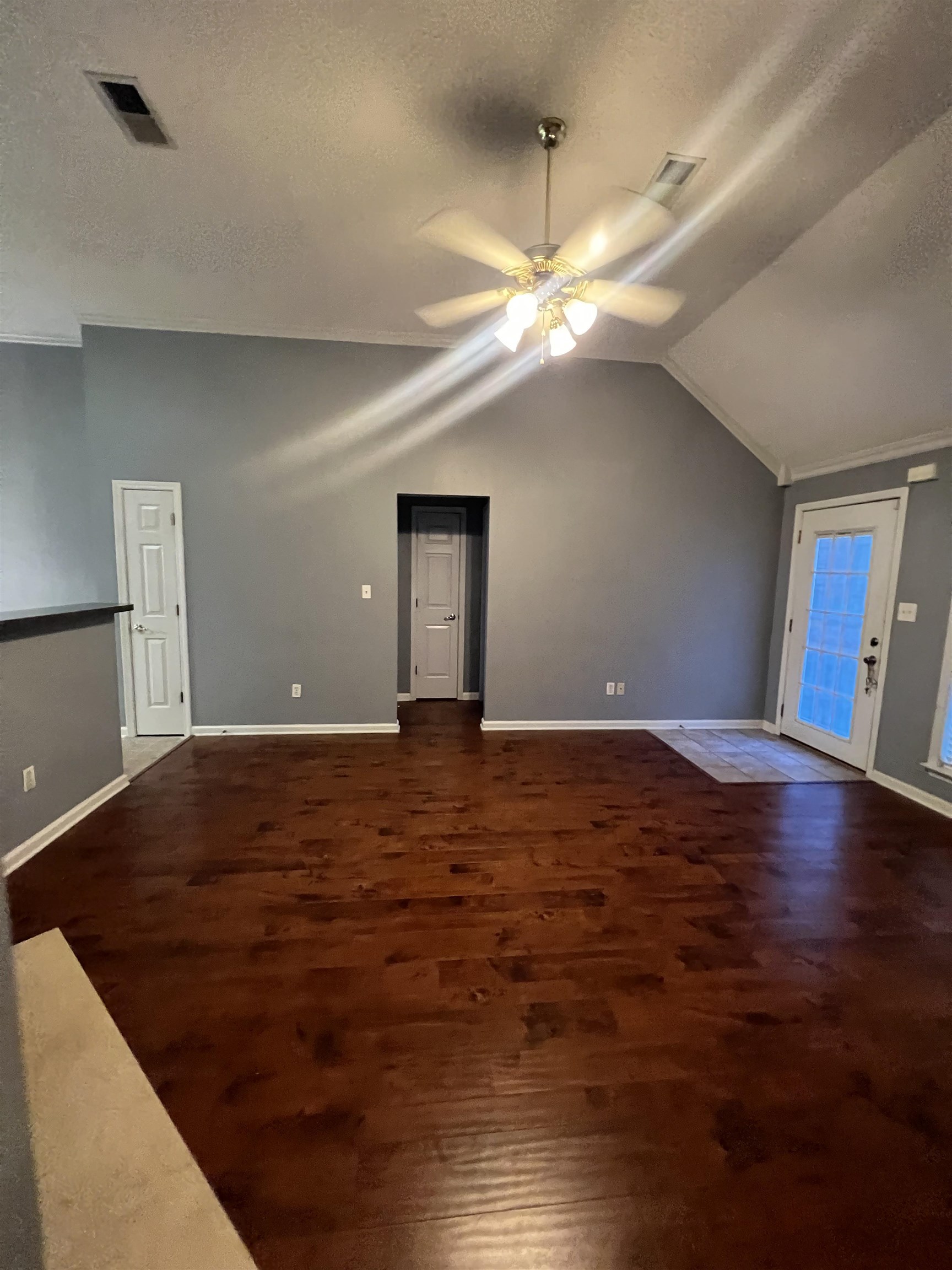 5645 Sycamore Ridge Road Memphis, TN 38134 - Photo 7 of 13 a view of an empty room with window and wooden floor