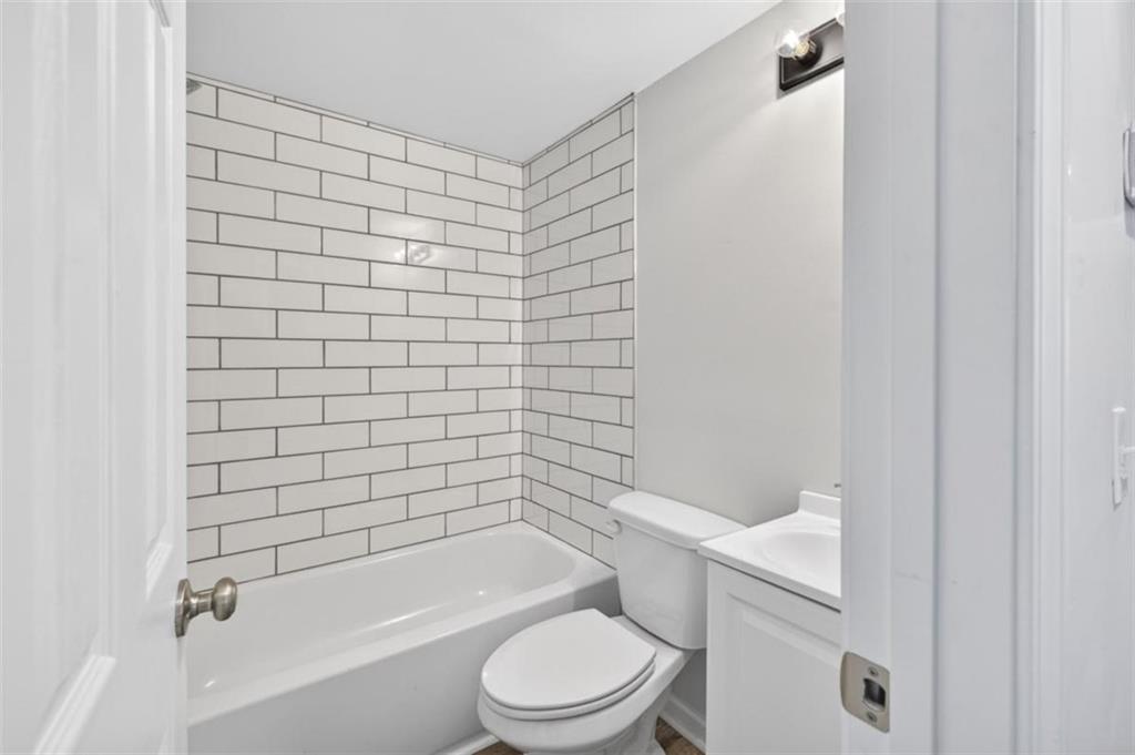 136 Nowell Street Monroe, GA 30655 - Photo 20 of 25 a bathroom with a toilet and shower