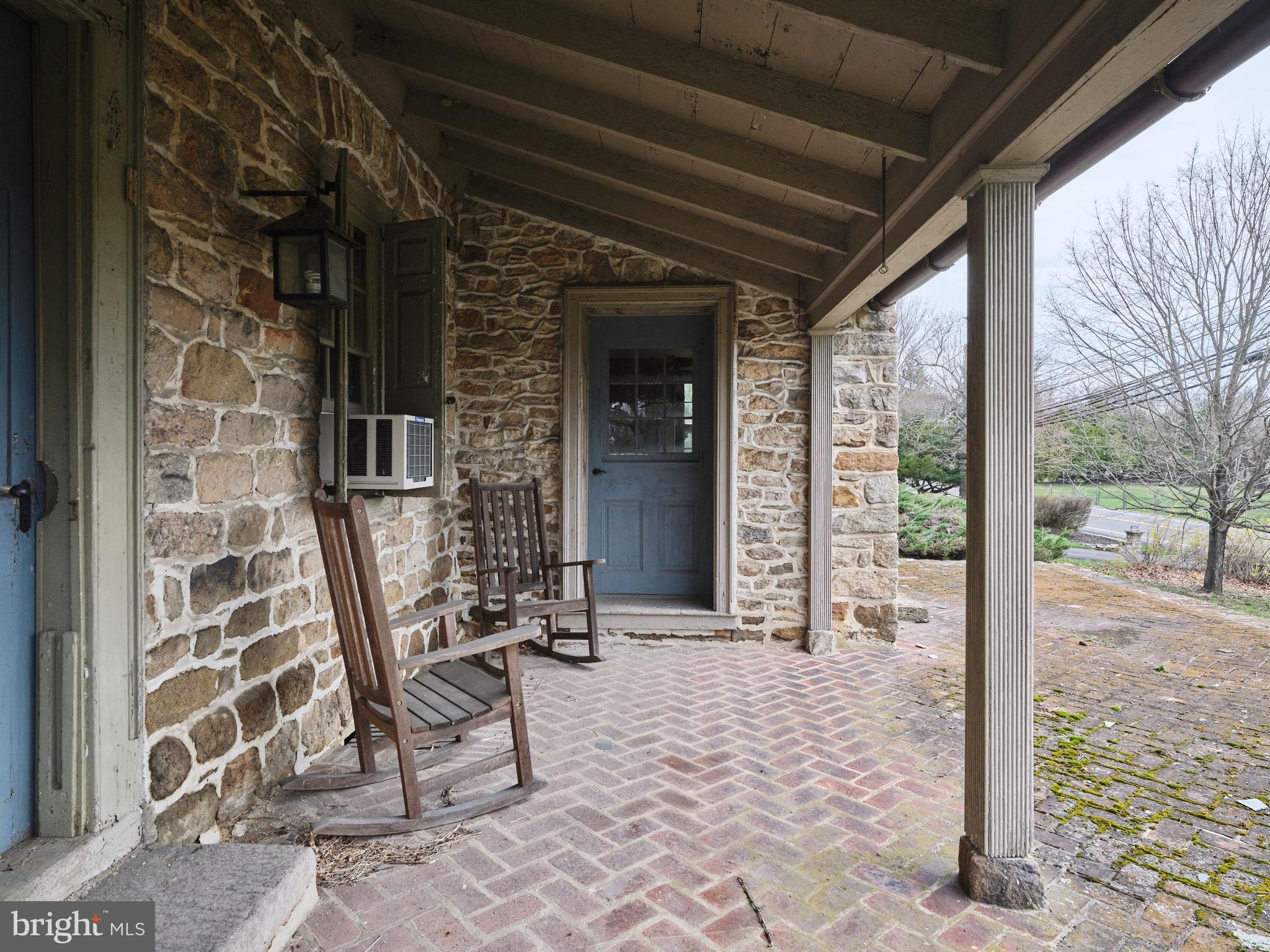 2519 Ash Mill Road Doylestown, PA 18902 - Photo 13 of 39 a view of a porch with a table and chairs