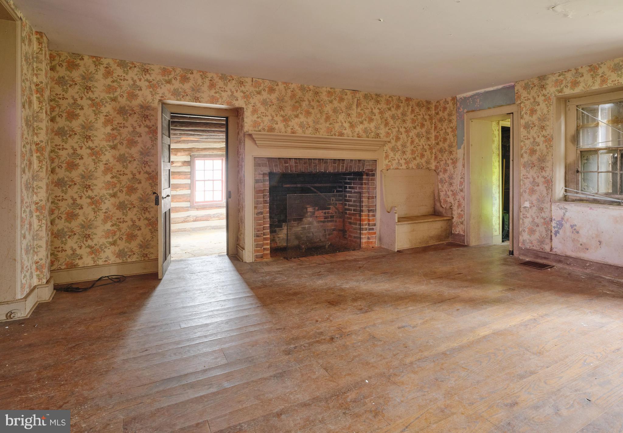 2519 Ash Mill Road Doylestown, PA 18902 - Photo 16 of 39 an empty room with windows and fireplace