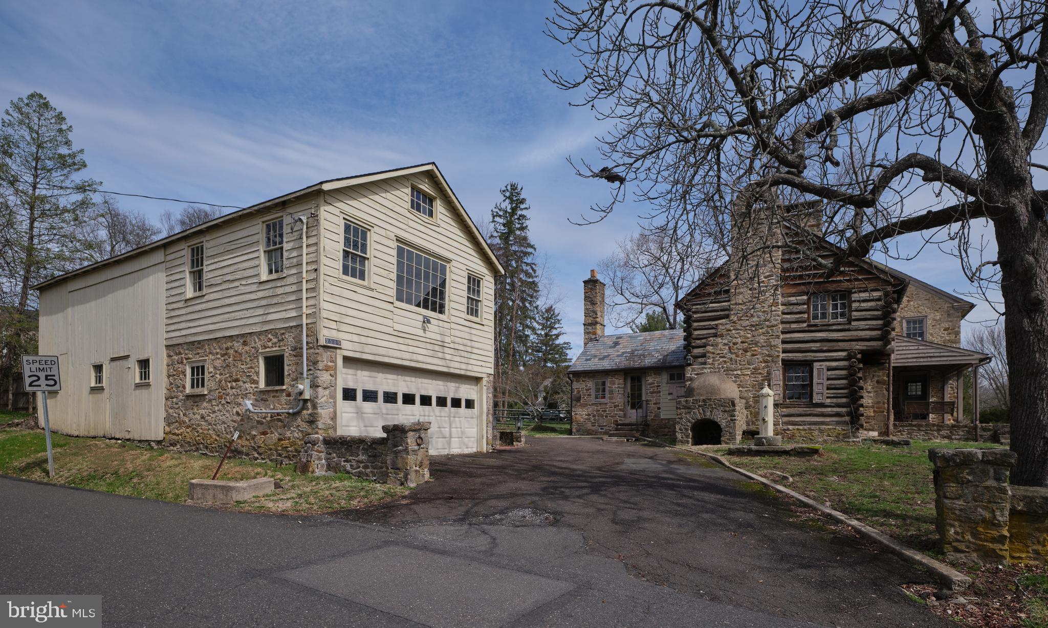 2519 Ash Mill Road Doylestown, PA 18902 - Photo 3 of 39 a large building with a large tree