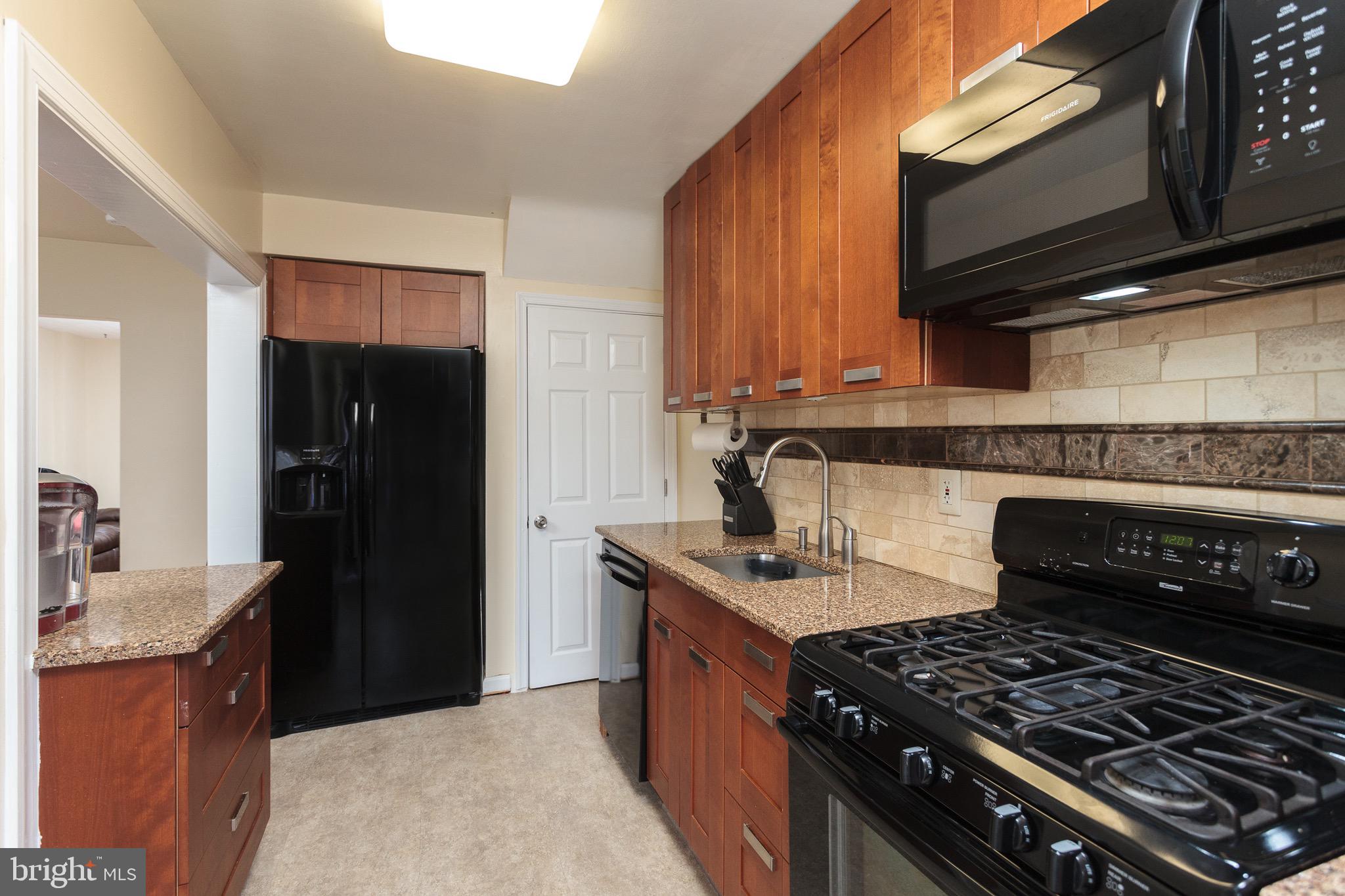 2128 Coralthorn Road Baltimore, MD 21220 - Photo 9 of 27 Matching black appliances.