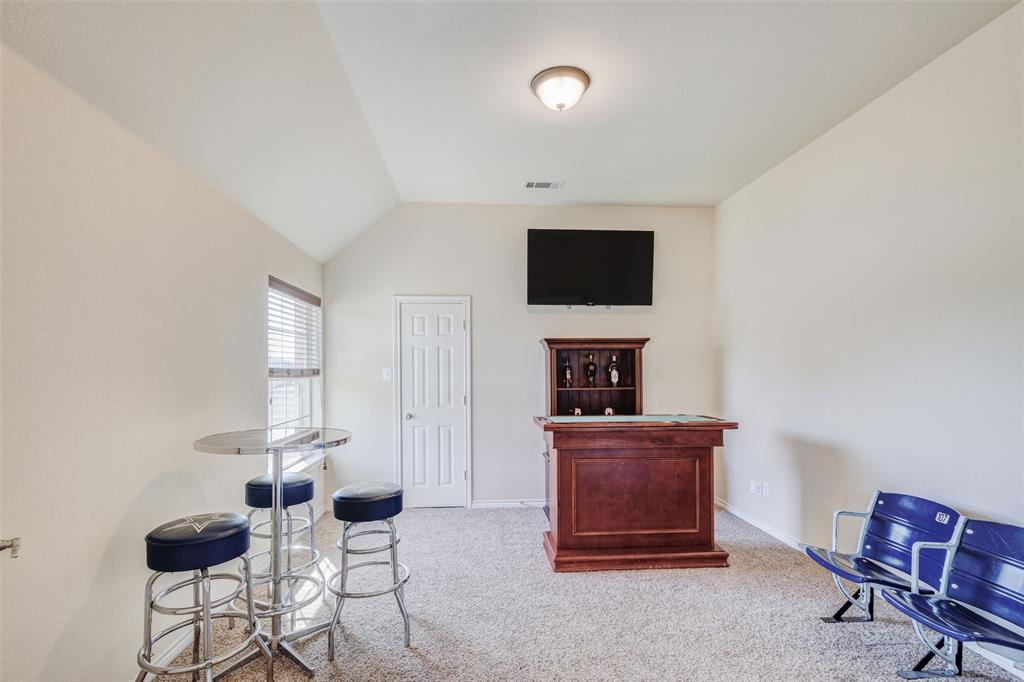 10414 Broadmoor Lane Rowlett, TX 75089 - Photo 21 of 38 Sitting room featuring light carpet and lofted ceiling