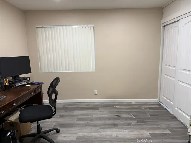 a workspace with furniture and wooden floor