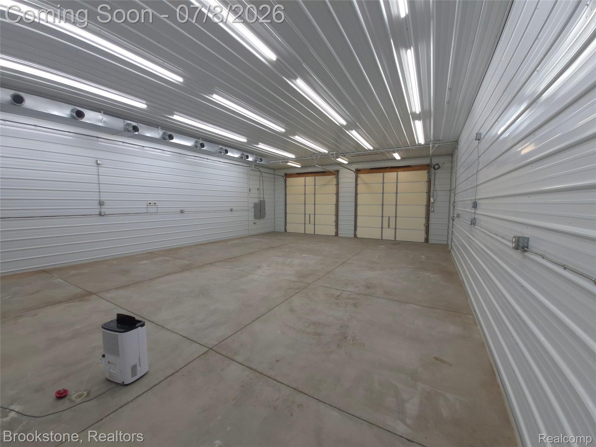 4140 South Henderson Road Davison, MI 48423 - Photo 17 of 98 Spacious interior with concrete flooring and corrugated metal walls