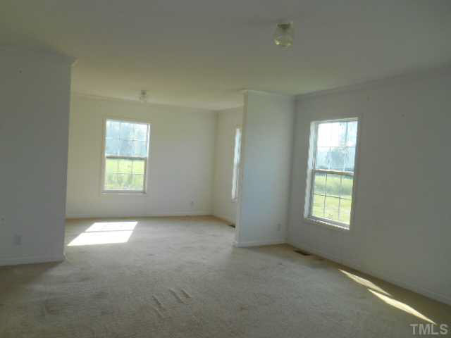 1353 Pixley Pritchard Road Timberlake, NC 27583 - Photo 5 of 12 an empty room with windows