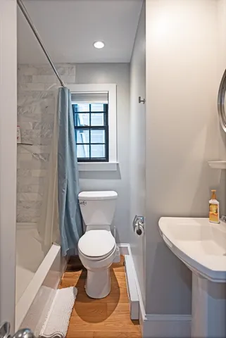 a bathroom with a toilet and a sink