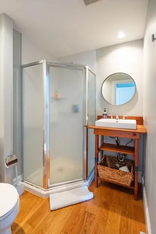 a bedroom with a bed and a mirror