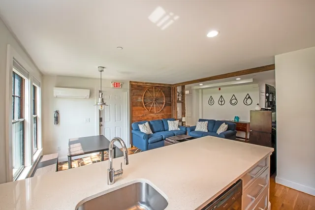 a bedroom with a bed and a large mirror