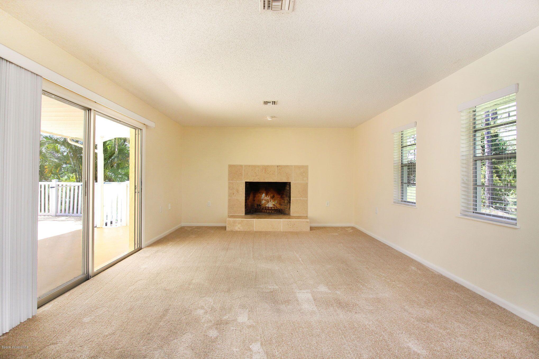 4521 Mustang Road Melbourne, FL 32934 - Photo 13 of 24 an empty room with windows