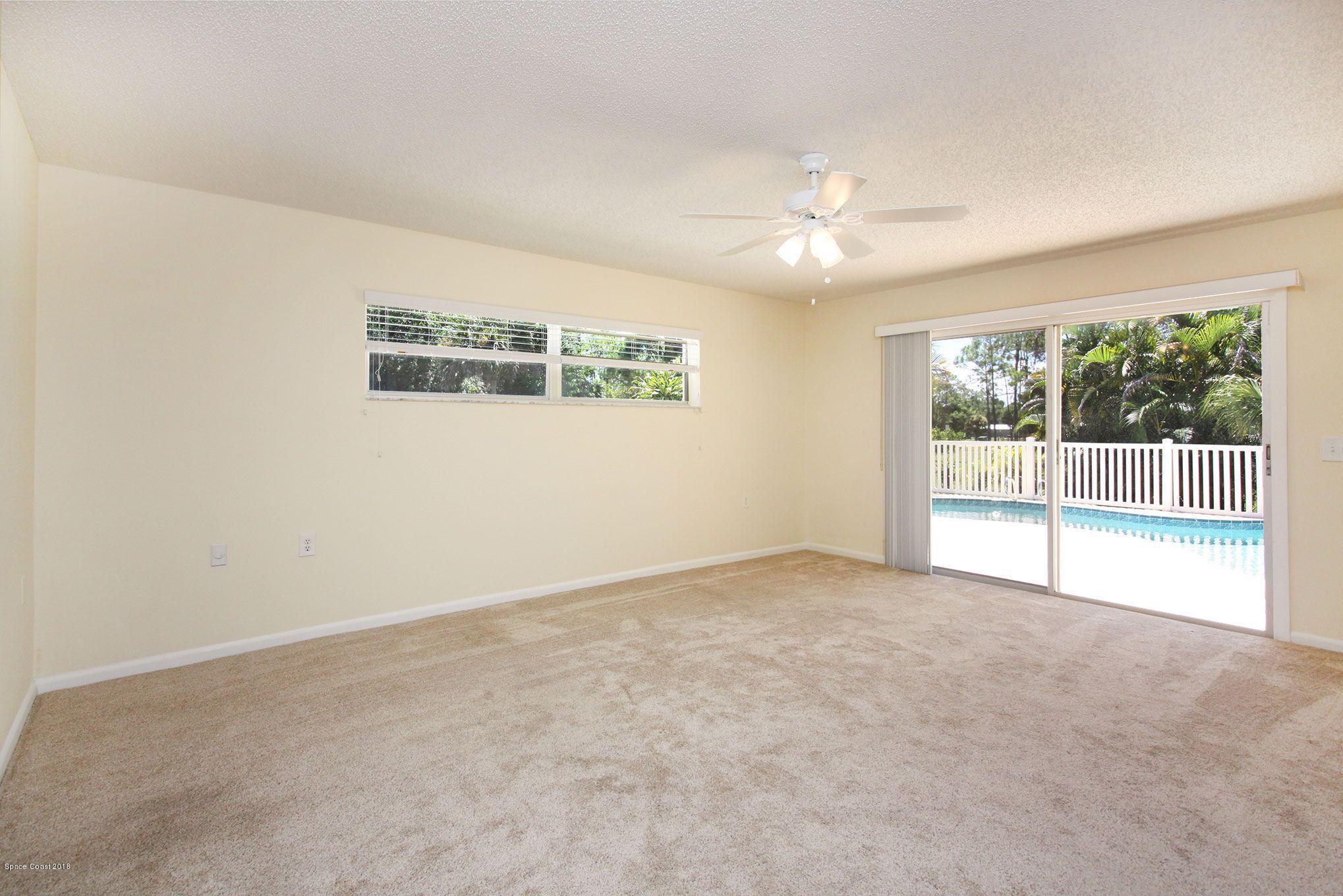 4521 Mustang Road Melbourne, FL 32934 - Photo 19 of 24 a view of an empty room with a window