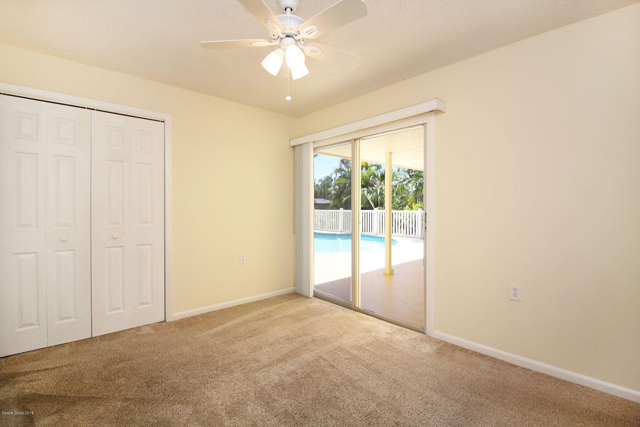 4521 Mustang Road Melbourne, FL 32934 - Photo 20 of 24 a view of an empty room with a window