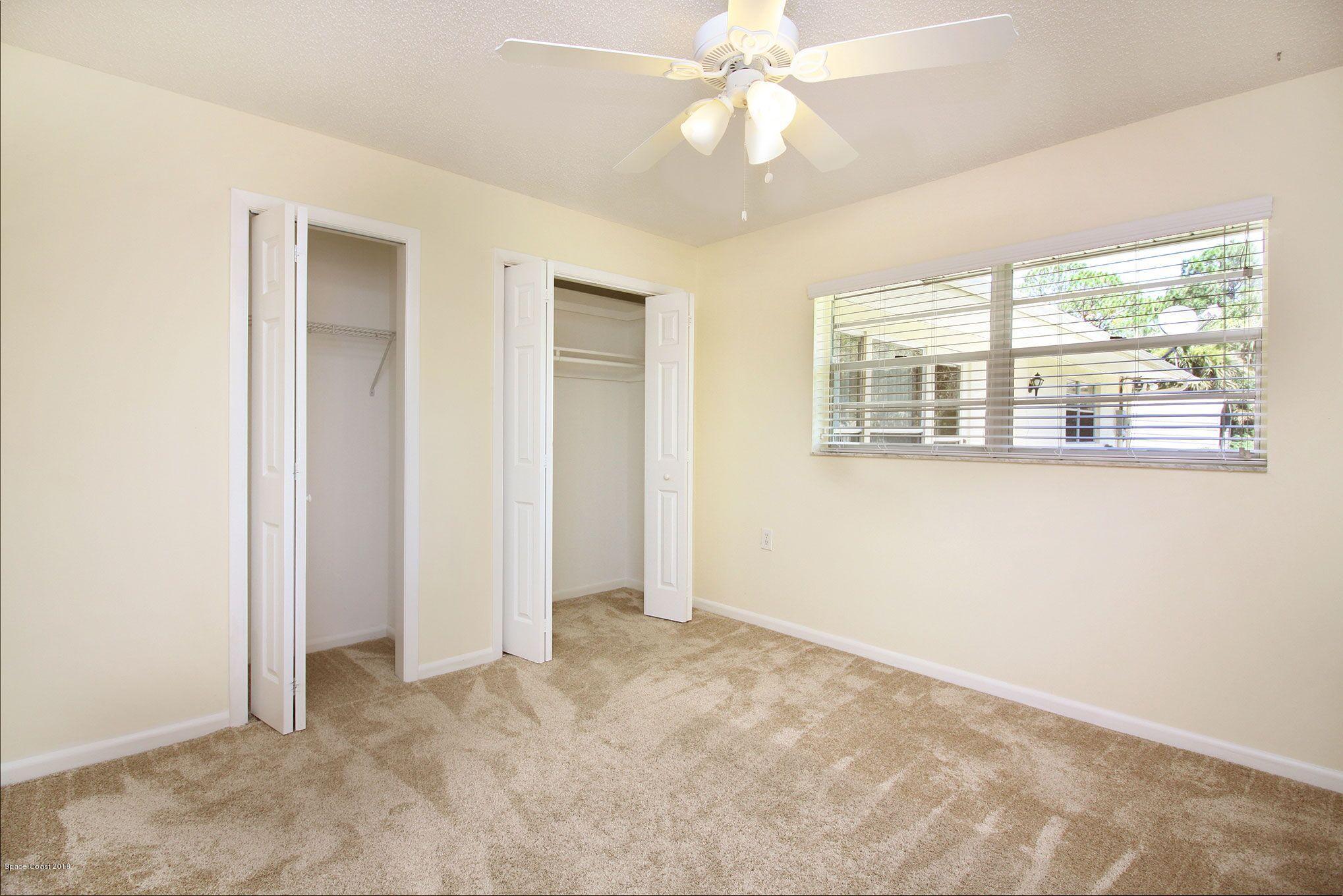 4521 Mustang Road Melbourne, FL 32934 - Photo 21 of 24 a view of an empty room with a window