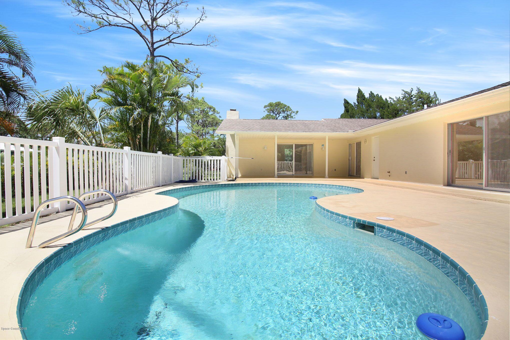 4521 Mustang Road Melbourne, FL 32934 - Photo 5 of 24 a view of a house with a yard