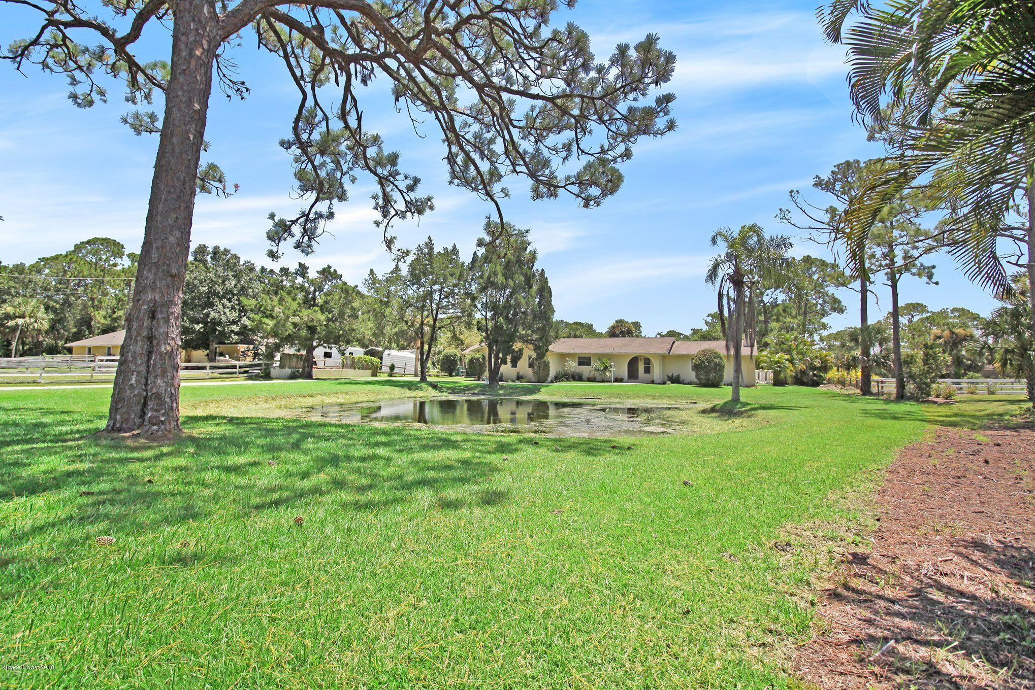 4521 Mustang Road Melbourne, FL 32934 - Photo 8 of 24 a view of a park with large trees