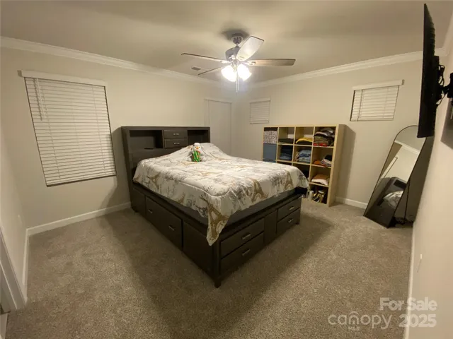 a bed sitting in a bedroom and table