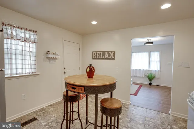 a view of a room with furniture and a potted plant
