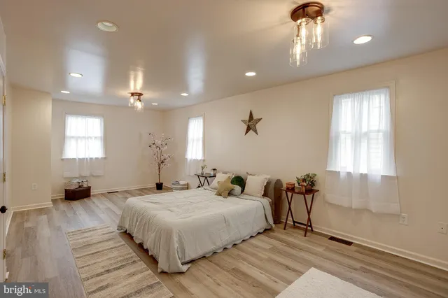 a bedroom with a bed and a table