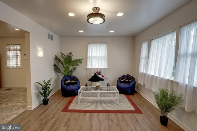 a view of a room with furniture and a potted plant
