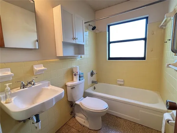 a bathroom with a sink toilet and bathtub