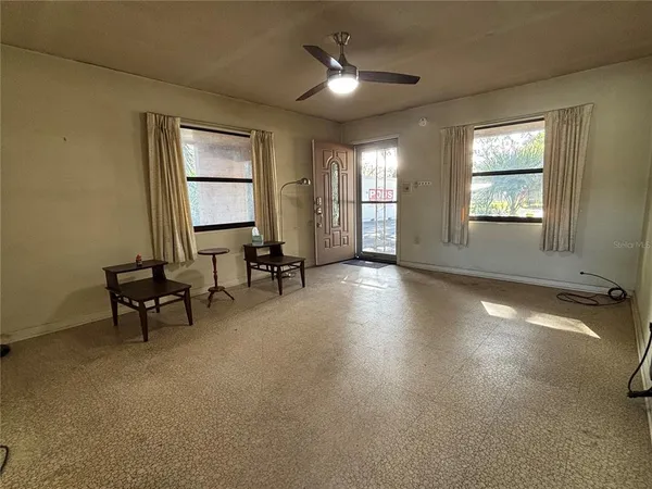 a living room with furniture and a window