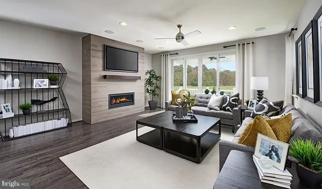 a living room with furniture fireplace and a flat screen tv