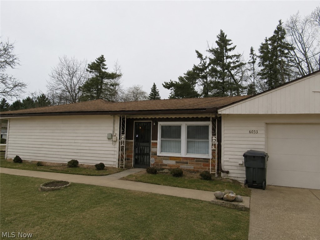 6033 Randy Road Bedford Heights, OH 44146 - Photo 1 of 19 Single-story residence featuring light-colored siding and a brown shingle roof