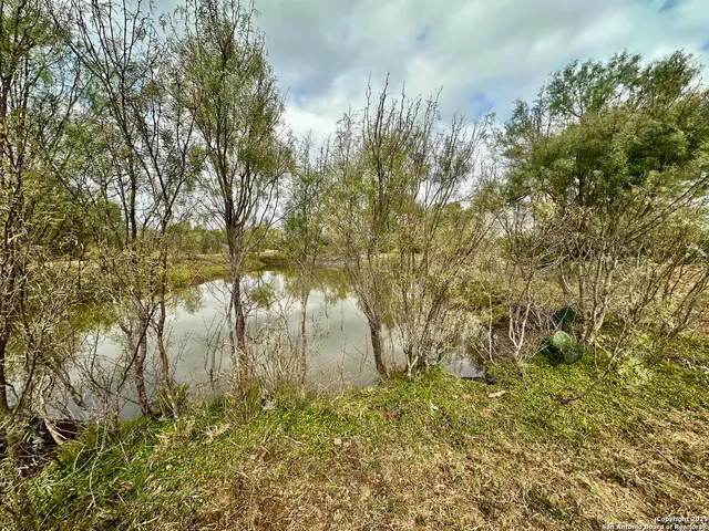 a view of lake with mountain in the background