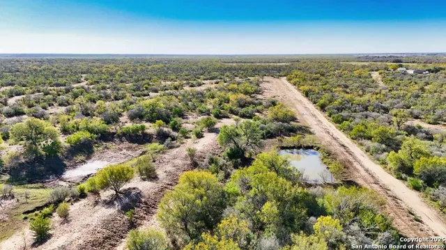 a view of a large body of water with a building in the background