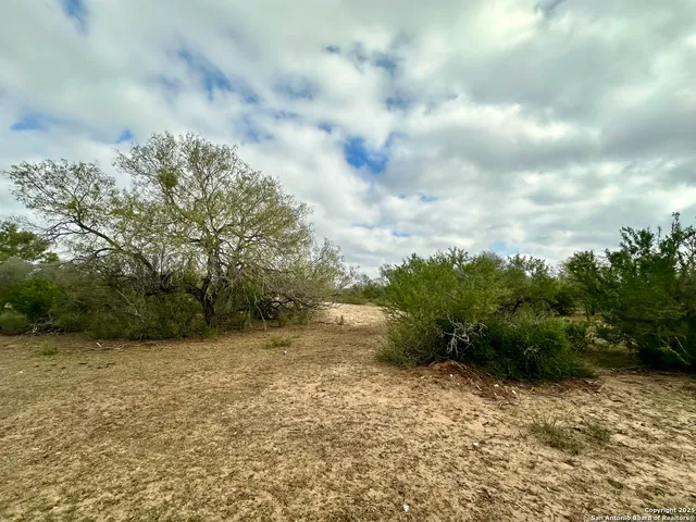 a view of a lake with houses in the back