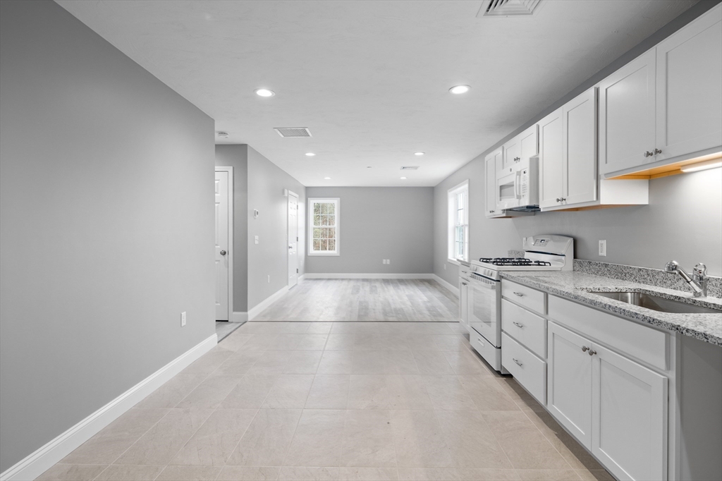 a view of a kitchen with electric appliances