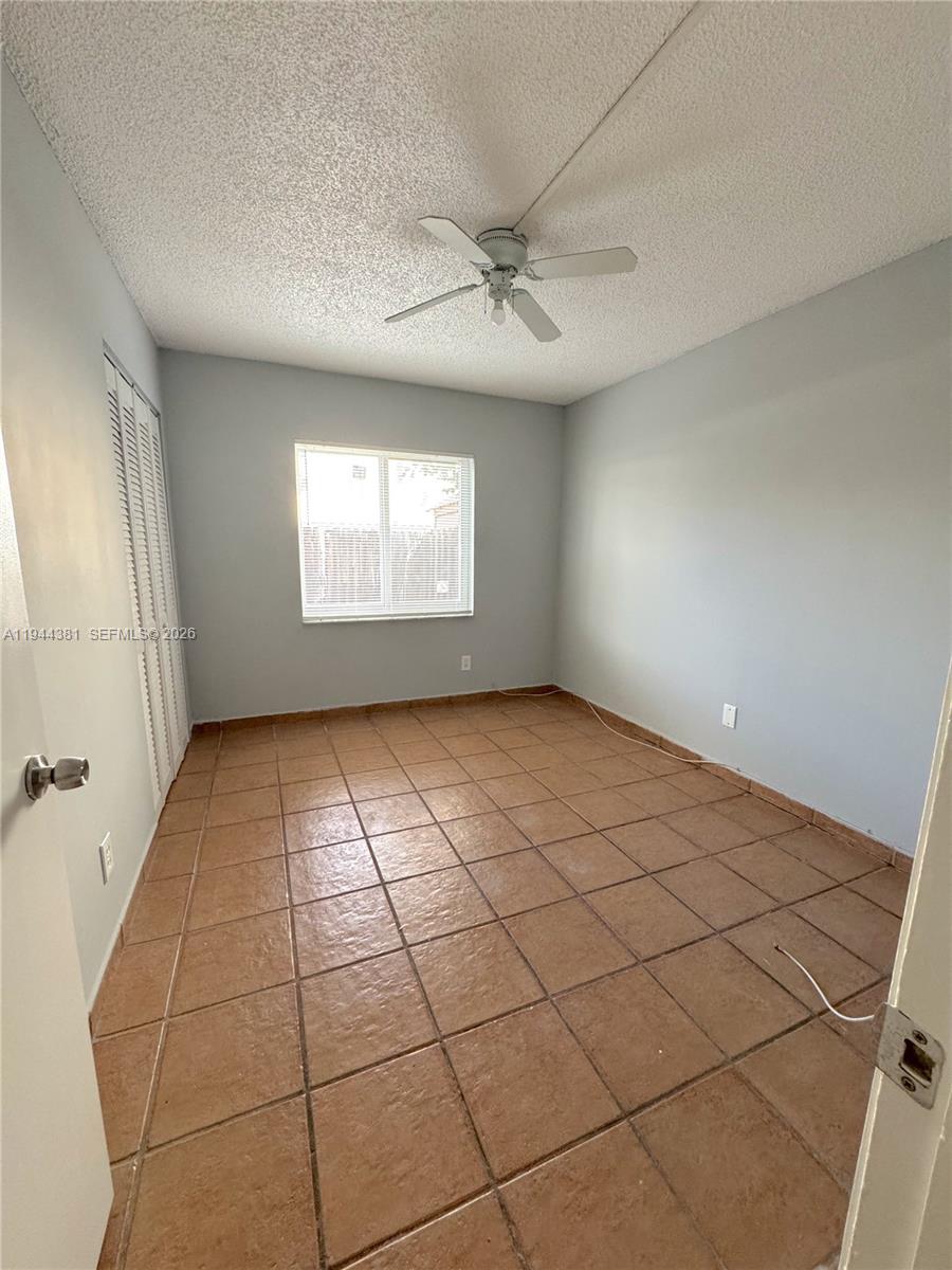 8536 Southwest 156th Court, Unit 210 Miami, FL 33193 - Photo 11 of 17 a view of an empty room and window
