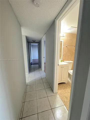 a view of an empty room and a window