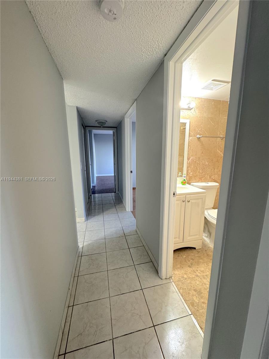 8536 Southwest 156th Court, Unit 210 Miami, FL 33193 - Photo 12 of 17 a view of an empty room and a window