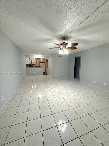 a view of a livingroom with natural light