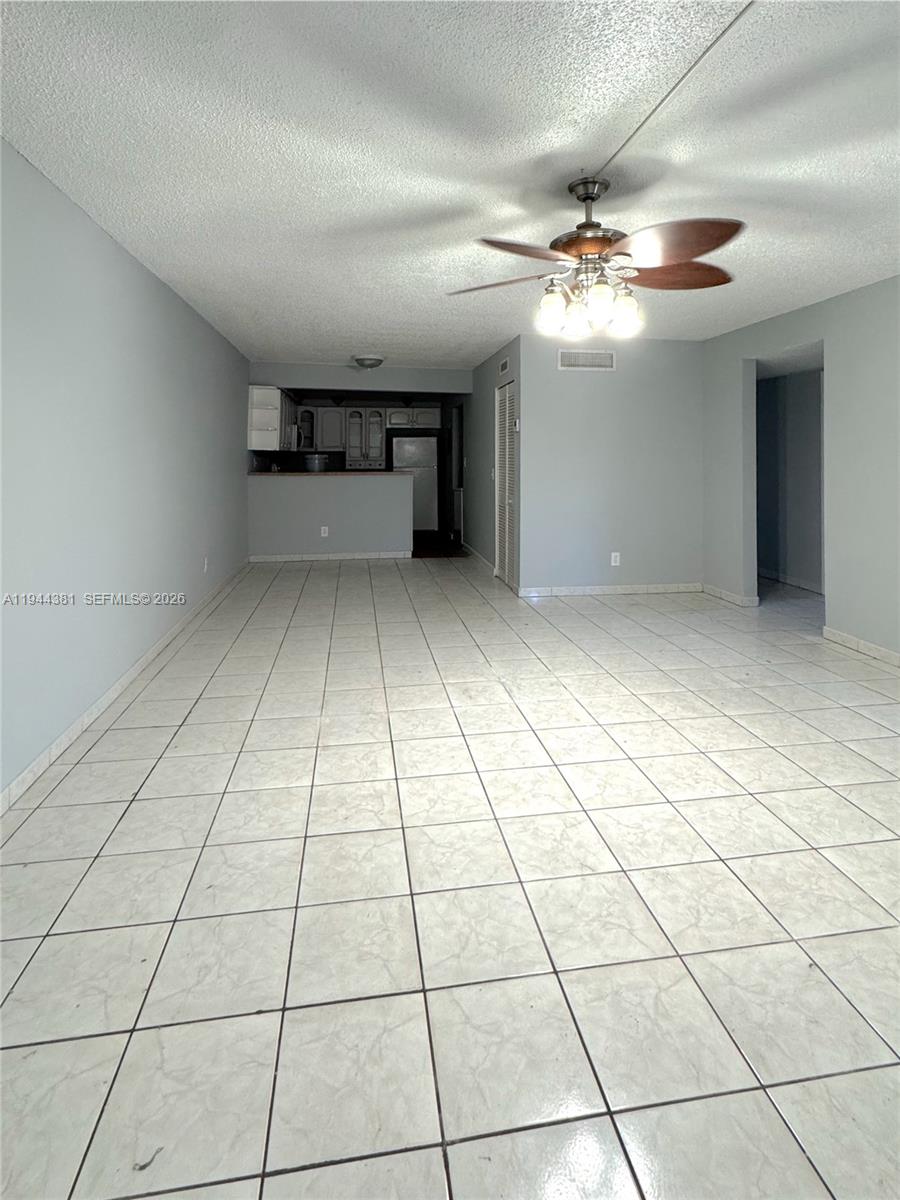 8536 Southwest 156th Court, Unit 210 Miami, FL 33193 - Photo 8 of 17 a view of a livingroom with a furniture and window