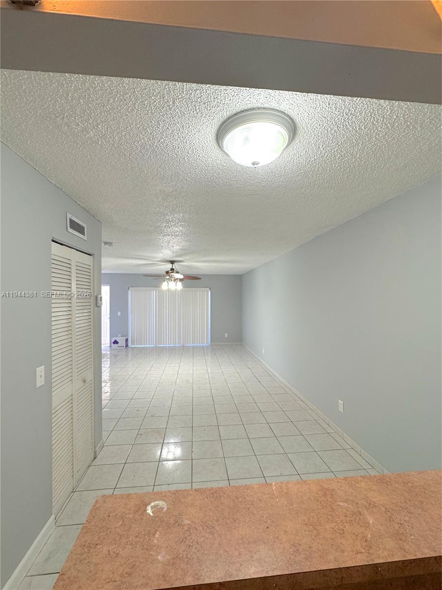 8536 Southwest 156th Court, Unit 210 Miami, FL 33193 - Photo 9 of 17 a view of an empty room