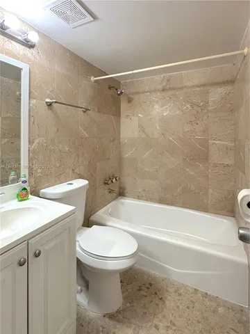 a bathroom with a sink a toilet and a bathtub